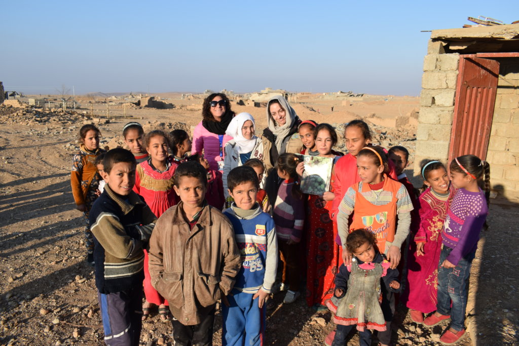 Some of the kids and COOPI Staff in the village