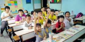 Children eat bread happily