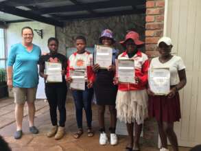 Mentees show off their certificates