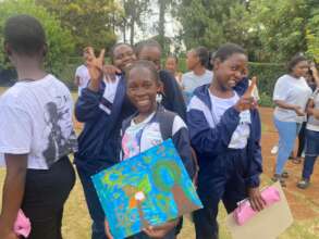 Someone looks pleased with their painting!