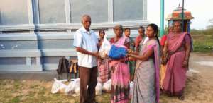 Elder receiving food groceries and clothes