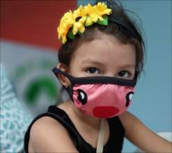 Family and friennds wear masks for open house