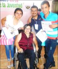 Heimy surrounded by workers in Social Employment