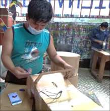 young men work on art projects using masks