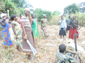Women farmers clear their garden
