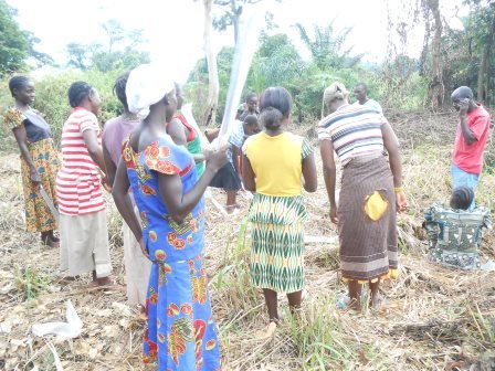 Women farmers clearing their garden