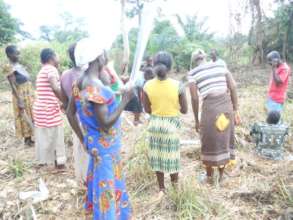 Women farmers clearing their garden