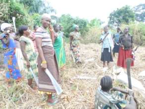 Women farmers clearing their garden