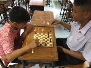 Playing Chess at Coconut Club