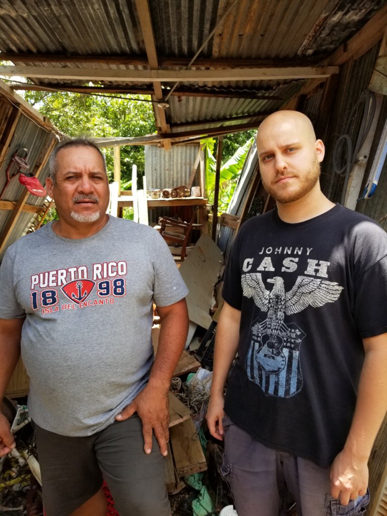 Standing outside this gentlemen's neighbor's home