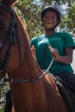 Child experiencing horse riding