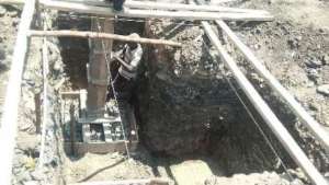 Worker building the pillar from the foundation.