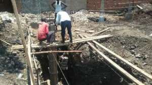 Erecting foundation pillar.