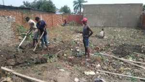Clearing the site for the building.