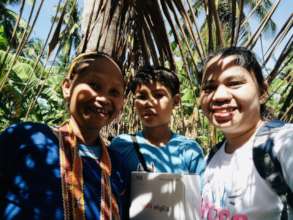 With a Mangyan child and his mother