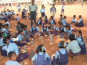 A school in Hubli - Children enjoying a a hot meal
