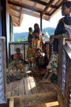 Ankave women wait to be seen by village midwives