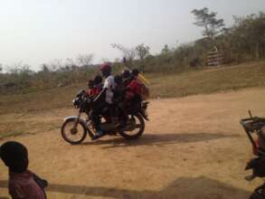 School children on a motorcycle