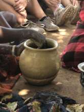 Ayak women group engaged in pottery