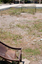 Jagged, rusted metal slide where children play