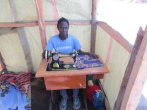 Micro-Credit Example-A Sewing Maschine & Materials