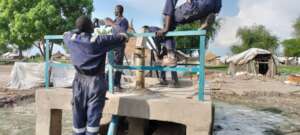 Repairing a well in Old Fangak.