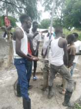 Drilling team repairing borehole