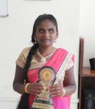 Vaishali holding Best Student Award proudly..