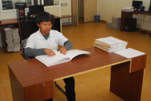 Mitra Jyothi Beneficiary Reading Braille book
