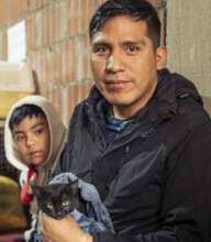 Father and son bring their cat for spaying