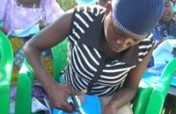 A sanitary pad sewing machine to a womens group