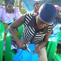 A sanitary pad sewing machine to a womens group