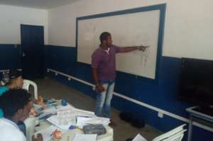 Youth leader Jesse teaching technical drawing!