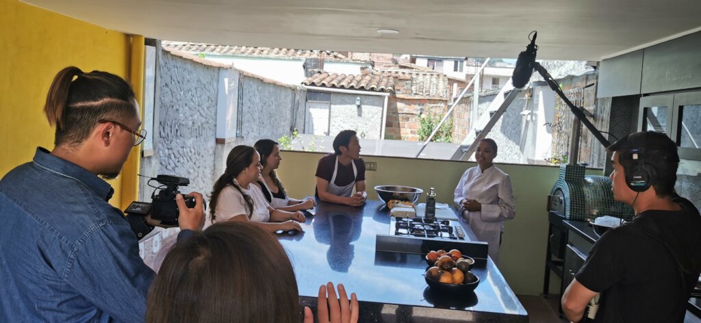 Karen teaching traditional arepas on the rooftop
