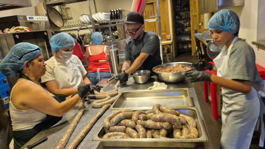 Daniel and family stuffing and prepping sausages