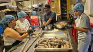 Daniel and family stuffing and prepping sausages