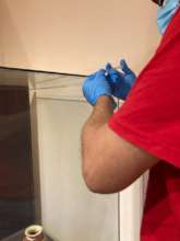 Maintenance on the exhibit cases in El Cano