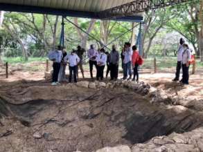 Explaining future plans to continue excavating