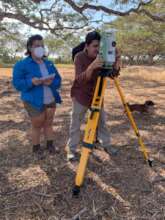 Arturo, Katherine working with the Total Station