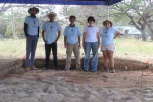 Dr. Julia Mayo with students and team members