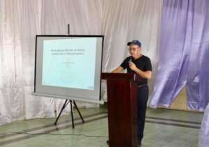 Dr. Carlos Mayo presenting at the university