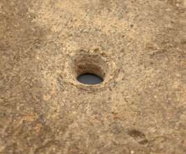 Conical hole made by hand drill in PAE project