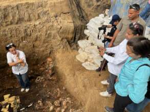 Dr. Mayo showing finds to the Minister of Culture