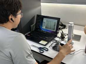 Abdiel G. analyzing tool marks on gold artifacts