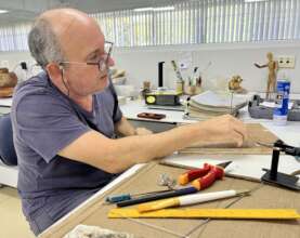 Carlos creating supports for artifacts