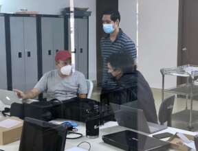 Dr. Mayo with James and Arturo at the FEC-CIAI lab