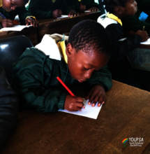 boy learning to create and illustrate his own book