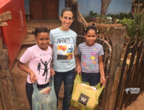 Children receiving books & educational materials