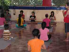 TLC girls teaching children's yoga class