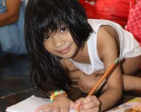 Anchel at home, practicing writing legibly